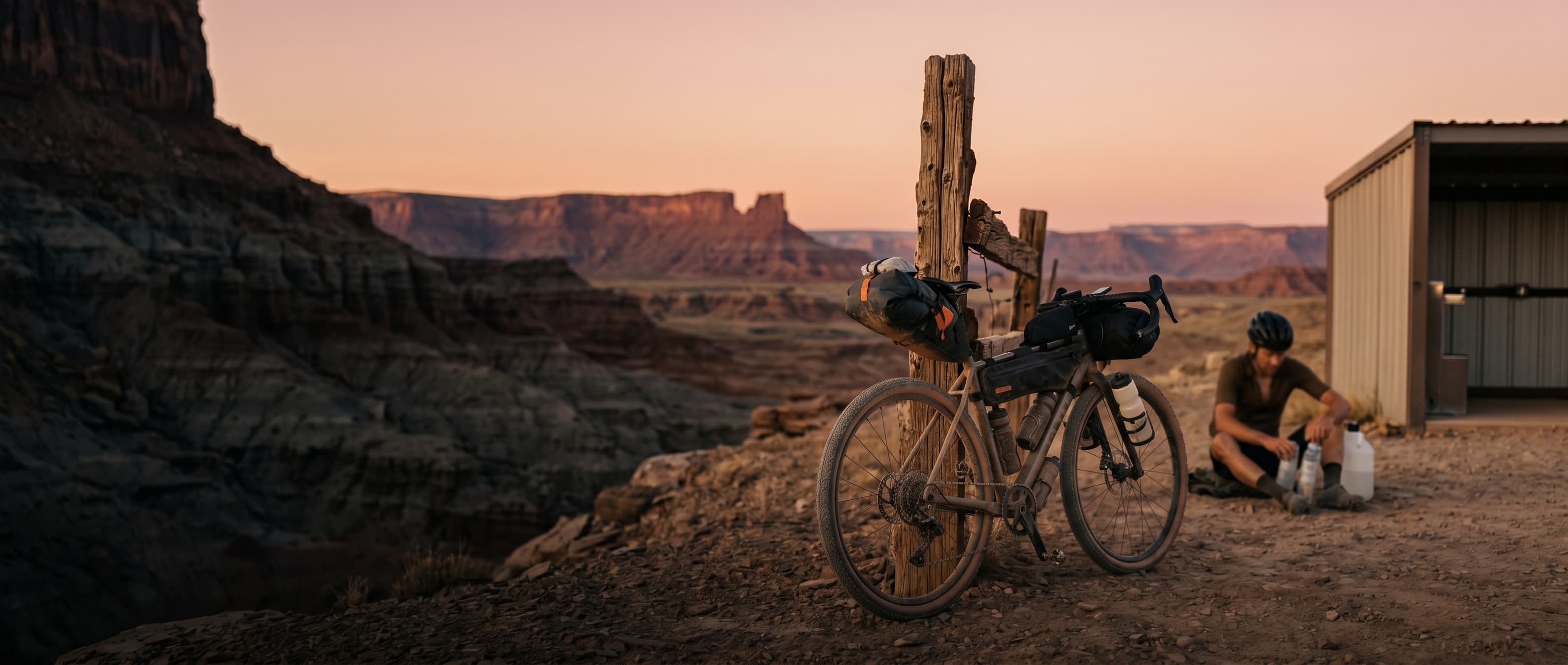 COACH — Bikepacker at checkpoint, dusk